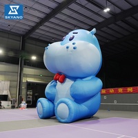 Modèle publicitaire gonflable personnalisé en forme d'hippopotame bleu pour événements et activités extérieures