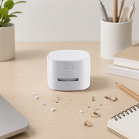 Mini aspirateur portatif USB rechargeable, haute puissance, moderne et compact, pour le nettoyage des petites saletés sur table de bureau et autres besoins quotidiens.