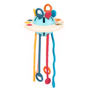 Bambino prescolare integrazione sensoriale sviluppo giocattoli volanti educativi bambini abilità UFO Silicone Pull String attività giocattolo per l'autismo