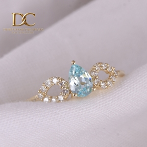 แหวนทองคำแท้ 14KT ดีไซน์หรูหรา ประดับเพชรเลี้ยงในห้องปฏิบัติการและพลอยสีฟ้าพาราอิบาเจียระไนทรงบริลเลียนท์ ได้รับการรับรองจาก IGI สำหรับสุภาพสตรี - Product Image 6