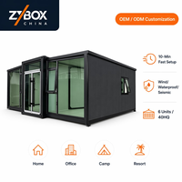 Contenedor Expandible Negro de 30x20 pies, OEM ODM, Montaje en 10 Minutos, Prefabricado, Clínica Móvil, Oficina, Campamento, Resort