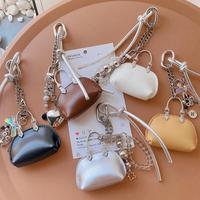 Sac à accessoires de créateur à suspendre, mini sac moderne en cuir PU, breloque de sac, petit sac coquille exquis de haute qualité, porte-clés de sac de luxe