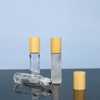 Flacon roll-on d'huile essentielle en verre transparent de 10 ml, marque Lvhuan, Zhejiang, avec bouchon en bambou et impression sérigraphiée, le choix privilégié des grossistes en cosmétiques