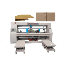 Machine à coudre industrielle pour boîtes en carton ondulé
