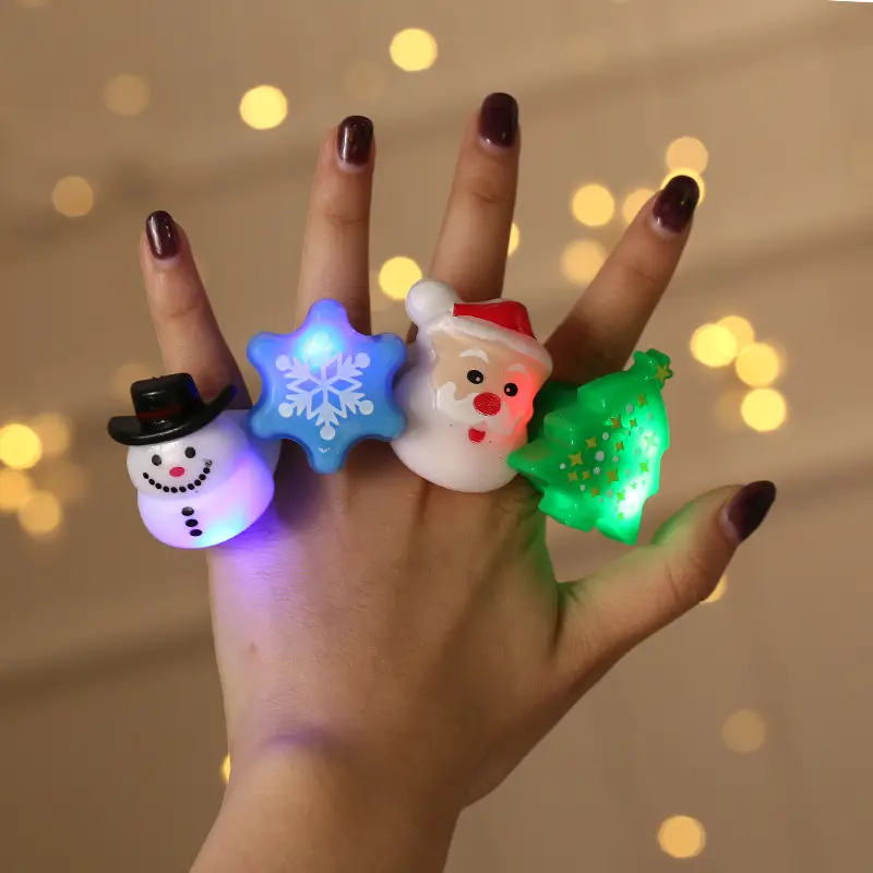 Intermitente LED Light Up Santa Muñeco de nieve Bumpy Toy Gift Navidad LED Glow Up Anillos Suministros para fiestas Navidad Intermitente Dedo brillante