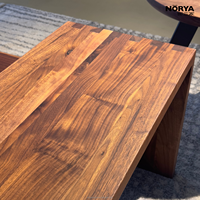 Table basse multifonctionnelle NORYA en bois massif avec plateau épais et patins de protection pour salon, mobilier en noyer