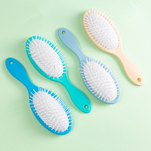 Peine de masaje ovalado Abs con cerdas de nailon acolchadas para alisar el cabello, uso doméstico para mujeres - Product Image 1
