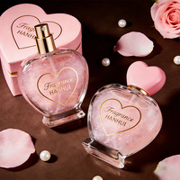 Flacon de parfum élégant en verre givré en forme de cœur avec accents dorés, logo personnalisé, support OEM ODM