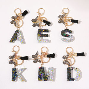 Gantungan Kunci Huruf Payet 2 Warna dengan Lem Kristal Personalisasi Baru dan Pesona Kupu-kupu Rumbai Hitam - Product Image 1