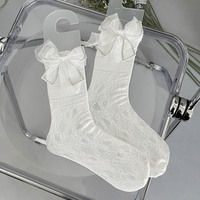 Chaussettes longues en dentelle résille pour filles de luxe avec grand nœud noir et blanc longueur d'équipage respirant et élégant pour la saison d'automne