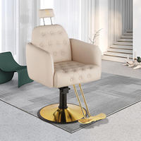 Vente en gros, fauteuil de barbier noir en cuir cabossé avec appui-tête et dossier en métal avec piètement rond doré