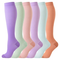 Chaussettes de compression unies mi-hautes pour femmes, bas longs unis, en nylon et élasthanne lisses, avec bord supérieur confortable, approvisionnement en gros OEM