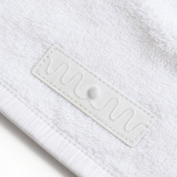 Étiquette RFID UHF lavable 860-960 MHz longue portée pour le suivi des textiles, du linge et des vêtements