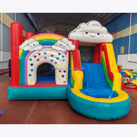 Château gonflable en PVC avec toboggan arc-en-ciel, location commerciale, fabrication OEM