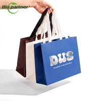 Sacs de courses en papier kraft recyclé en gros avec poignée pour boutiques, commerces de détail, épiceries et magasins de vêtements