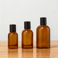 Vente en gros de flacons de parfum en verre ambré cylindriques de 30 ml, vides, avec vaporisateur à pompe et couvercle noir, emballage en boîte