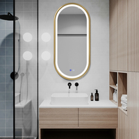 Espejo de Baño Inteligente Moderno y Popular con Iluminación LED Ajustable, Marco Ovalado Dorado de Lujo, Antivaho, para Salón