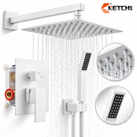 Système de douche pluie mural en laiton avec mitigeur, pommeau de douche pluie, douchette à main et bouton inverseur, finition laiton doré et noir