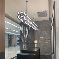 Lustre moderne ovale long en verre à bulles multiples pour la décoration intérieure des hôtels, des restaurants et des bars