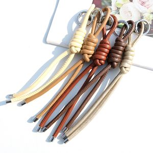 En gros, Porte-clés en cuir tressé multicolore avec breloques de sac et accessoires - Product Image 6