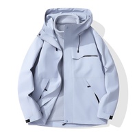 Veste de travail d'hiver imperméable unisexe à capuche trois-en-un avec logo imprimé et doublure en polaire pour la montagne