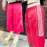 Pantalon court unisexe personnalisé en nylon et polyester avec bande latérale, coupe ample et oversize, idéal pour l'été, style jogger ou short de sport pour homme