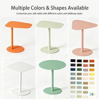 Table basse Eaho au design moderne et élégant en fer, avec plateau asymétrique réglable