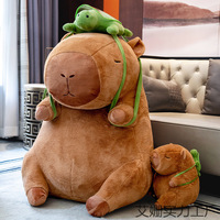 Logo personnalisé poupée en peluche Capybara portant une tortue géante grande taille nez qui coule Capybara en peluche dessin animé décoration d'oreiller