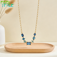 Collier de clavicule en acier inoxydable 316 avec revêtement PVD or épais de 3 microns maximum, perles incrustées de grand zircon bleu et breloque