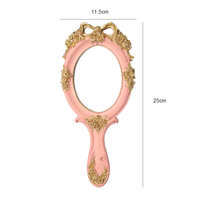 Miroir de maquillage à main en métal rose gaufré ovale européen de luxe Miroir à main cosmétique de voyage princesse vintage avec poignée
