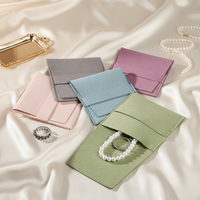 Petits sacs en velours de luxe pour bijoux avec logo personnalisé et pochette à boutons pour bijoux vente en gros