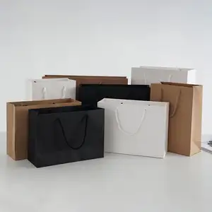 De calidad superior logotipo personalizado impreso bolsa de papel para regalo/ropa de papel de embalaje de bolsa de compras con mango corte