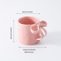 Mug en porcelaine peint personnalisable de 260 ml avec anse en ruban nœud papillon – Design moderne, compatible lave-vaisselle et micro-ondes, idéal pour le thé