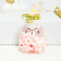 Porte-clés créatif et tendance en acrylique multi-formes avec paillettes liquides, breloque Sakura à pétales de fleurs roses flottants, style dessin animé mignon