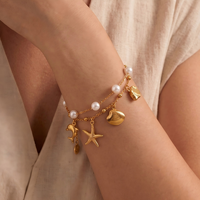 Bracelet double couche en acier inoxydable plaqué or 18 carats avec breloques océaniques, perle, étoile de mer, dauphin et coquillage, bracelet d'été pour femme