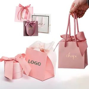 Custom small boutique Luxury cardboard pink shopping gift jewellery pouch and jewelry packaging paper bag with ribbon handle