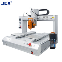 Machine de distribution entièrement automatique à double tête et deux stations pour seringues de colle époxy, UV et thermofusible avec fonction de revêtement et de goutte-à-goutte