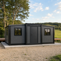 Maison conteneur pliable extensible gris foncé pour le glamping et l'hébergement temporaire