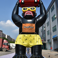 Modèle de gorille noir gonflable géant avec accessoire de voiture - Figurine gonflable publicitaire personnalisée pour l'assurance automobile pour les promotions