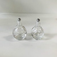 Vente en gros 10ml bouteille en verre de rouleau en forme de boule ronde transparente avec bouchon en or brillant