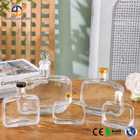 Bouteille diffuseur en verre transparent avec présentoir de style boutique pour la merchandising de parfums en magasins spécialisés et sur étagères
