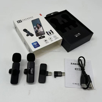 Produk laris mikrofon Lavalier 2.4GHz 1Drag 2 K9 mikrofon portabel klip nirkabel Lavalier Live konferensi untuk ponsel iphone dan Android