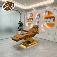 Table de massage électrique hydraulique pliable de luxe avec base en métal doré et extension incurvée personnalisée pour salon et salle de sport