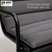 Fauteuil lounge moderne intérieur/extérieur avec structure en métal, coussin capitonné gris anthracite, style minimaliste