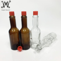 Bouteille en verre pour sauce piquante de couleur ambre de 2oz avec couvercle en plastique