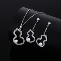 Vente en gros de boucles d'oreilles haut de gamme collier ensemble de bagues colliers de perles de gourde creuse bagues plaquées or incrustées de zircon ensemble de bijoux pour femmes