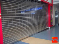 Porte à enroulement moderne en alliage d'aluminium argenté personnalisée avec commande facile pour immeuble de bureaux