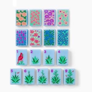 The Mahjong Line 160 American mahjong tiles, single-layer blue acrylic with musical note and floral patterns - Product Image 1