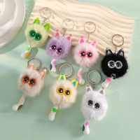 Porte-clés tendance le plus vendu, avec pompon en métal argenté, structure duveteuse, garniture oreille de pêche, breloque œil d'étoile et queue de chat