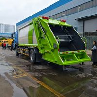 Camion Compacteur de Déchets Diesel Euro 3 Manuel 4x2 Howo 15m³ de Haute Qualité à Chargement Arrière pour le Transport et la Compression des Déchets